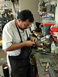 man working on shoes